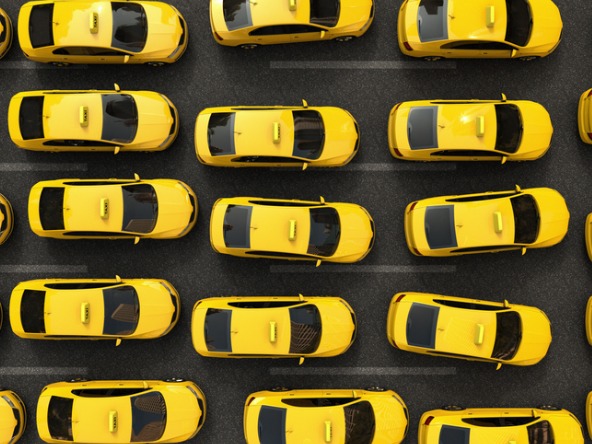 multiple yellow taxis viewed from above